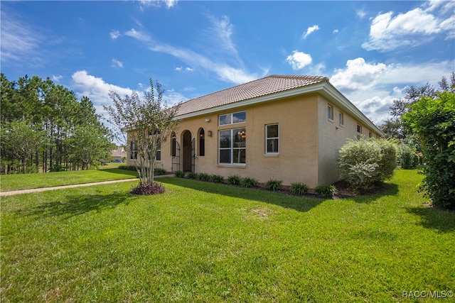 exterior space featuring a lawn