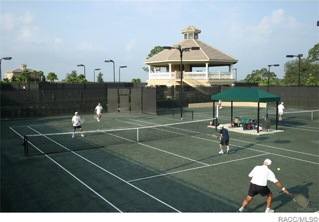 1052 W Diamond Shore Loop, Hernando, FL 34442 - view of tennis court featuring fence