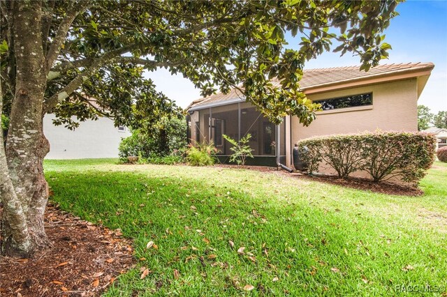 1052 W Diamond Shore Loop, Hernando, FL 34442 - view of green lawn featuring a sunroom