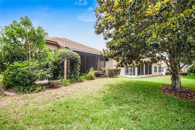 1052 W Diamond Shore Loop, Hernando, FL 34442 - view of grassy yard with a sunroom