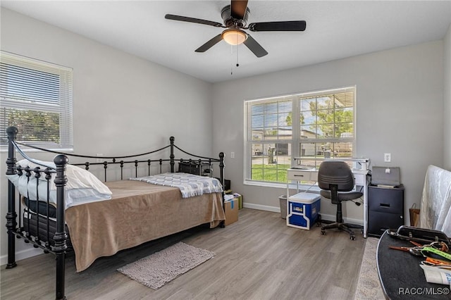 1930 NW 17th St, Crystal River, FL 34428 - bathroom with vanity, wood finished floors, toilet, baseboards, and curtained shower