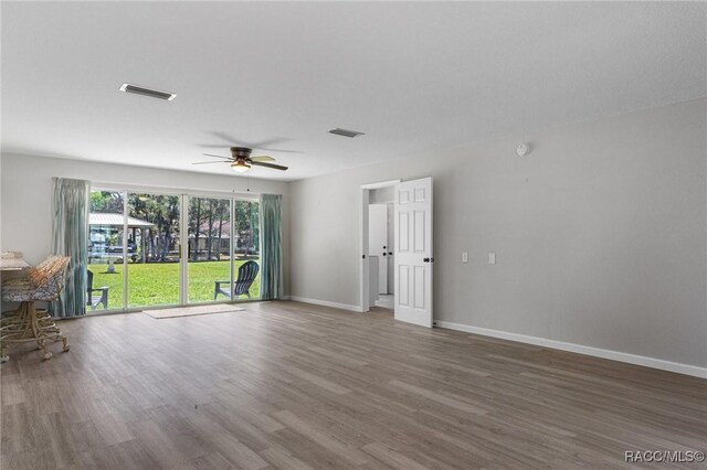1930 NW 17th St, Crystal River, FL 34428 - kitchen with appliances with stainless steel finishes, under cabinet range hood, wood finished floors, and a textured ceiling