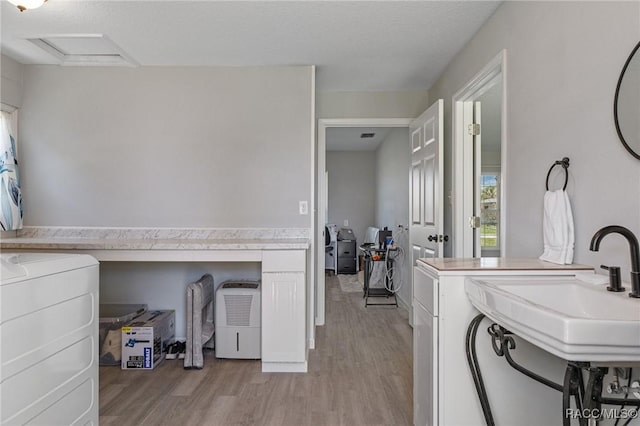 1930 NW 17th St, Crystal River, FL 34428 - hallway featuring wood finished floors, baseboards, and a sink