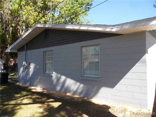 view of property exterior with a yard