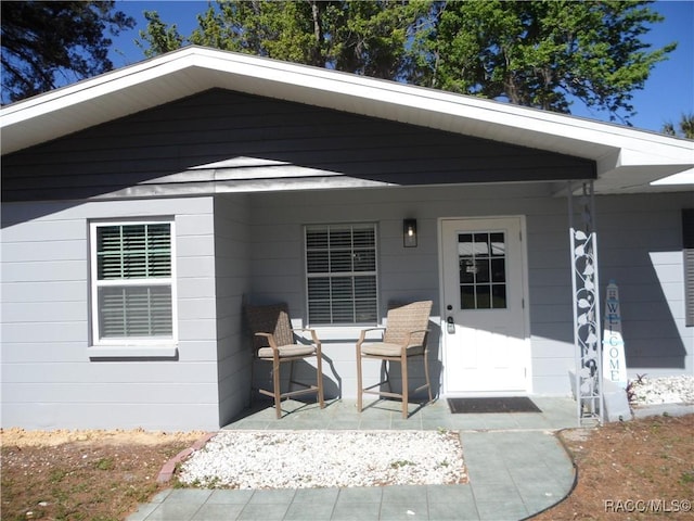 property entrance with a patio area