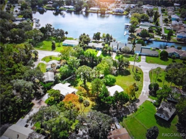 drone / aerial view with a water view and a residential view