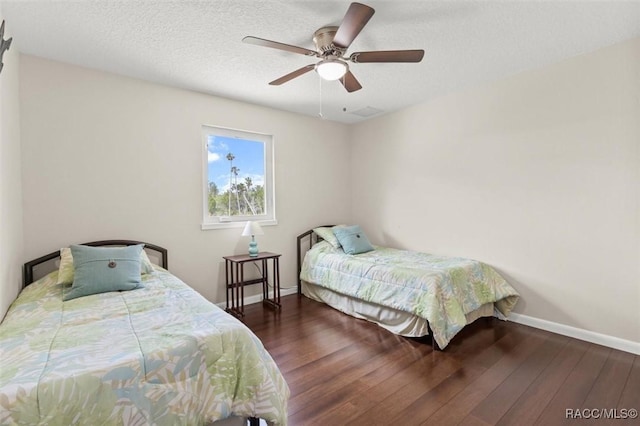 5500 S Cedar Mill Path, Homosassa, FL 34448 - bedroom with wood finished floors, a ceiling fan, and a textured ceiling