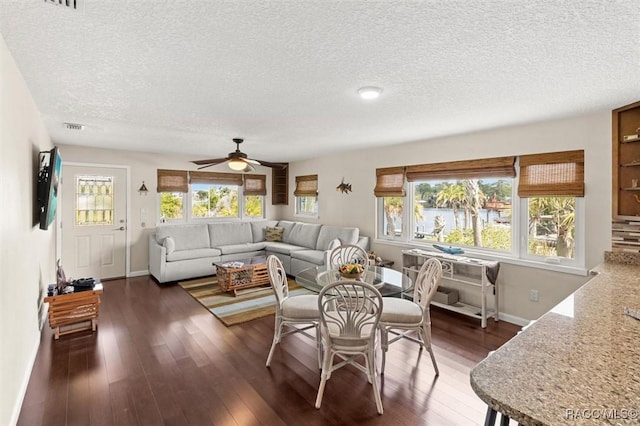 5500 S Cedar Mill Path, Homosassa, FL 34448 - dining area featuring a textured ceiling, wood finished floors, a ceiling fan, and plenty of natural light