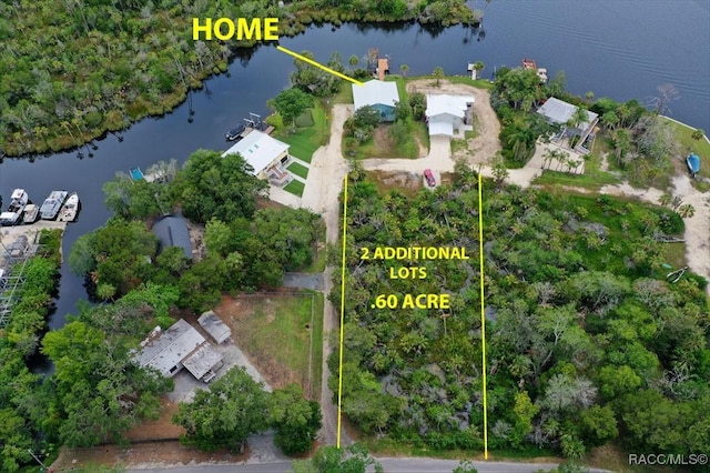 5500 S Cedar Mill Path, Homosassa, FL 34448 - aerial view of property and surrounding area featuring a nearby body of water and property boundaries highlighted