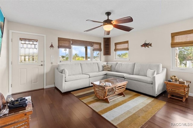 5500 S Cedar Mill Path, Homosassa, FL 34448 - living area featuring ceiling fan, dark wood-style floors, and a textured ceiling