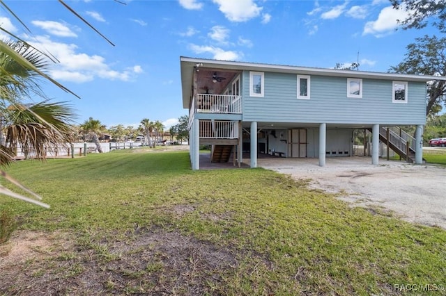 5500 S Cedar Mill Path, Homosassa, FL 34448 - rear view of property with stairway, a carport, driveway, and ceiling fan