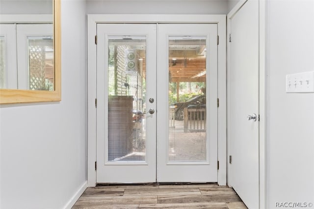 entryway featuring french doors and light hardwood / wood-style flooring