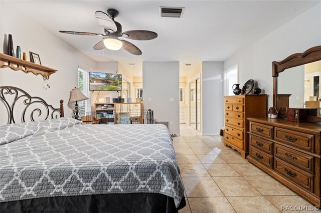 tiled bedroom with ceiling fan