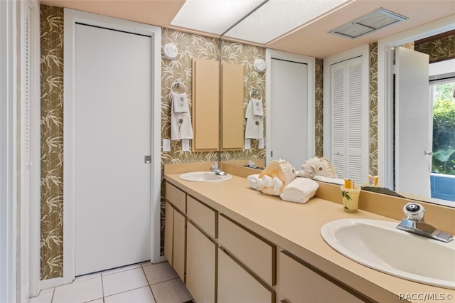 bathroom with vanity and tile patterned floors