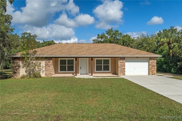 single story home with a front yard and a garage