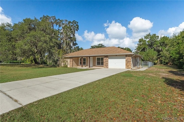 ranch-style home with a front lawn and a garage