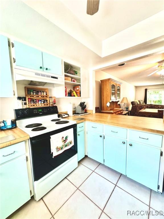 kitchen featuring blue cabinetry, light countertops, electric range oven, ceiling fan, and under cabinet range hood