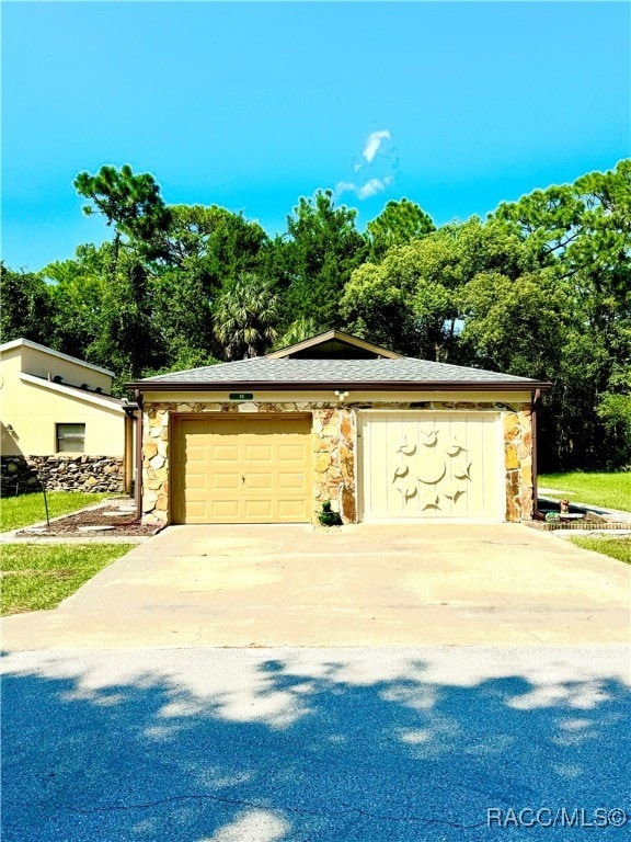 view of front of house featuring an outbuilding and a garage