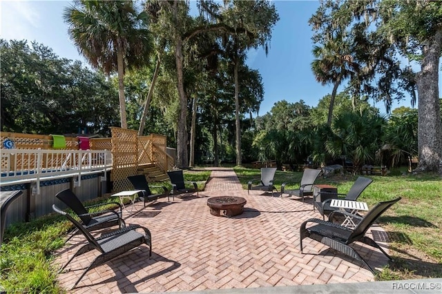 view of patio / terrace with a fire pit