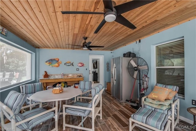 dining area featuring wood ceiling, ceiling fan, dark wood-type flooring, and vaulted ceiling