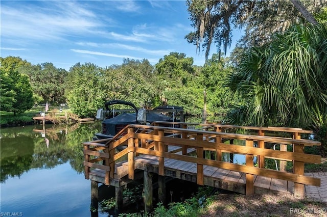 dock area featuring a water view