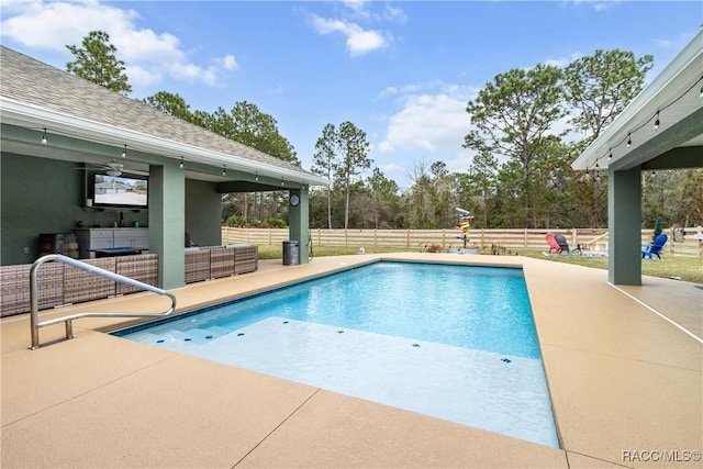 view of swimming pool with an outdoor hangout area, ceiling fan, and a patio area