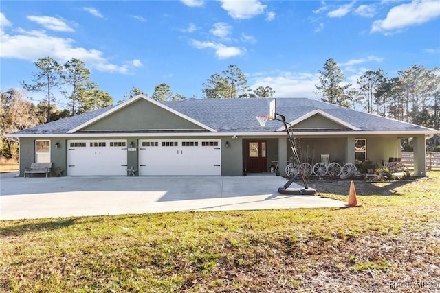 ranch-style home featuring a garage and a front lawn