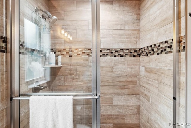 bathroom featuring an enclosed shower