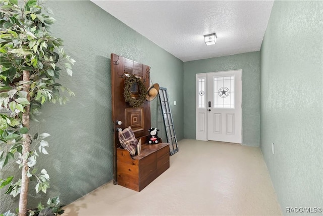 entryway with a textured ceiling