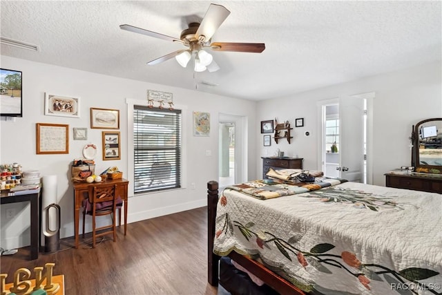 bedroom with dark hardwood / wood-style flooring, a textured ceiling, and ceiling fan