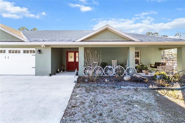 single story home with a garage and covered porch