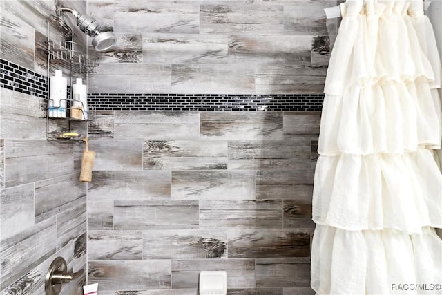 bathroom with a shower with shower curtain