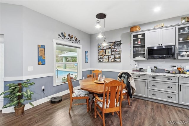 dining space featuring dark hardwood / wood-style floors