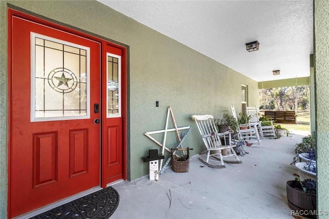 entrance to property with covered porch