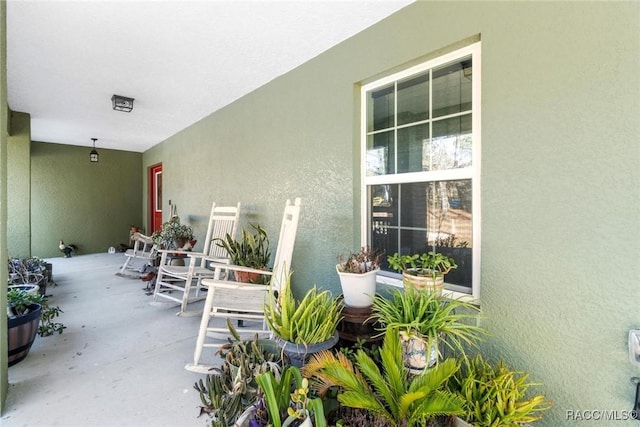 view of patio featuring a porch