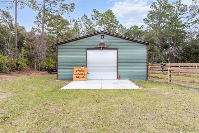 garage featuring a lawn