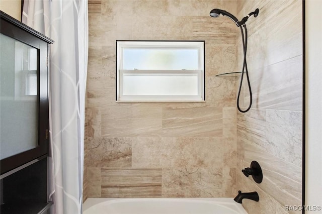 bathroom with shower / tub combo