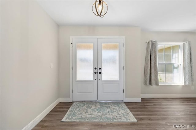 entrance foyer with dark wood-type flooring and french doors