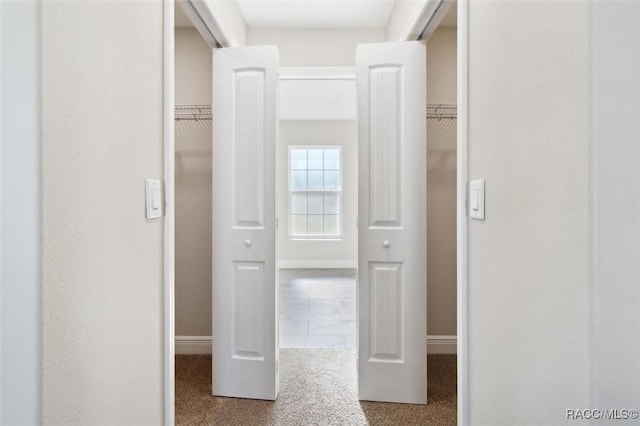 corridor with light carpet