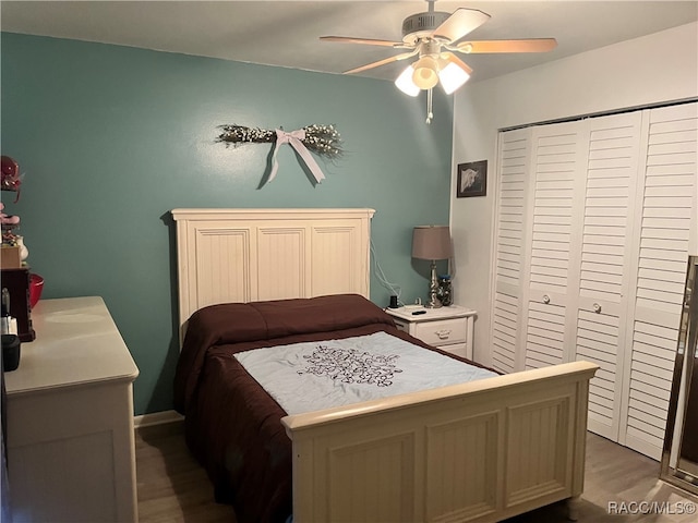 bedroom featuring a closet, ceiling fan, and hardwood / wood-style floors