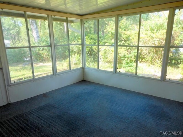 unfurnished sunroom featuring a healthy amount of sunlight