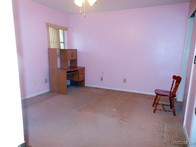 unfurnished bedroom with carpet flooring and baseboards