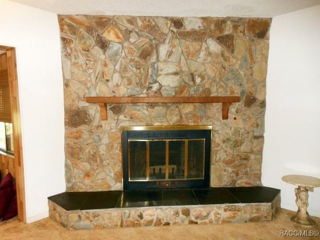 interior details with carpet flooring and a fireplace