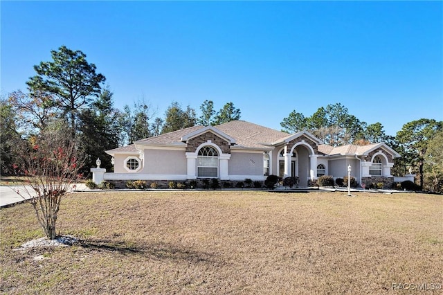 ranch-style house with a front yard