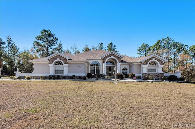 ranch-style house with a front lawn