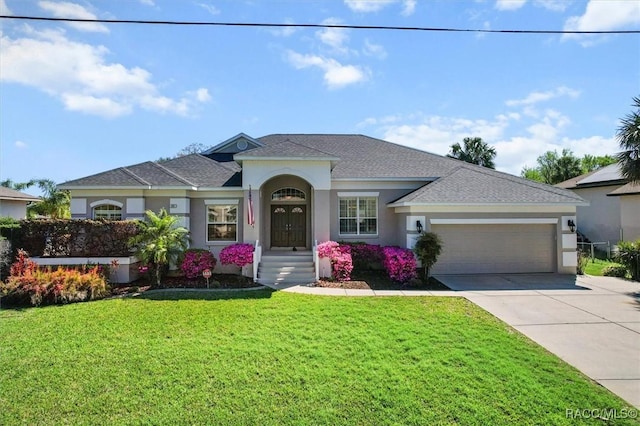 single story home featuring concrete driveway, an attached garage, a front yard, and stucco siding