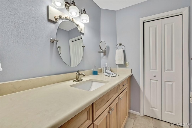 2891 N Rivers Edge Blvd Unit 100, Crystal River, FL 34429 - bathroom with vanity, tile patterned floors, and a closet