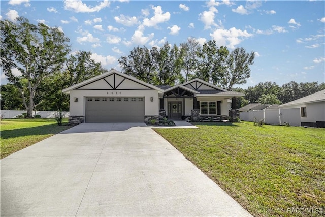 view of front facade with a front yard and a garage