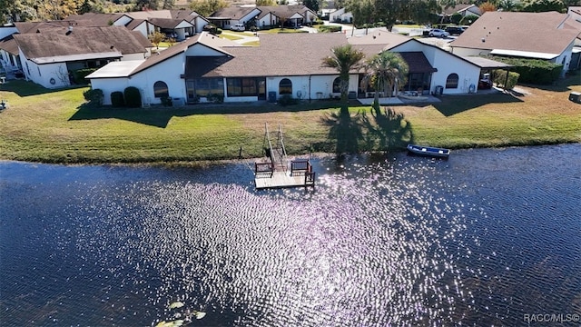 birds eye view of property featuring a residential view and a water view