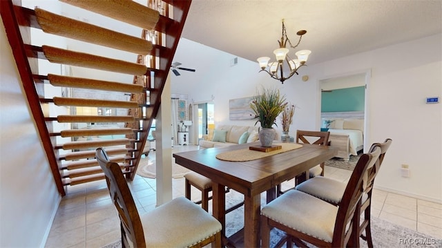 dining area with ceiling fan with notable chandelier, light tile patterned floors, baseboards, and visible vents